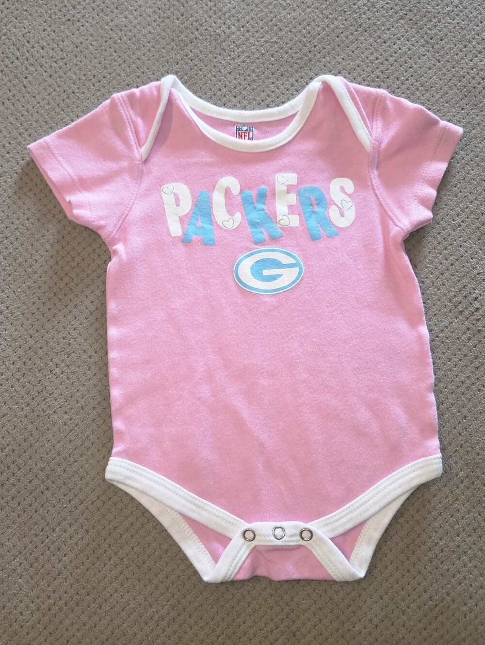 pink Green Bay Packers infant short sleeve bodysuit onesie with the team's name